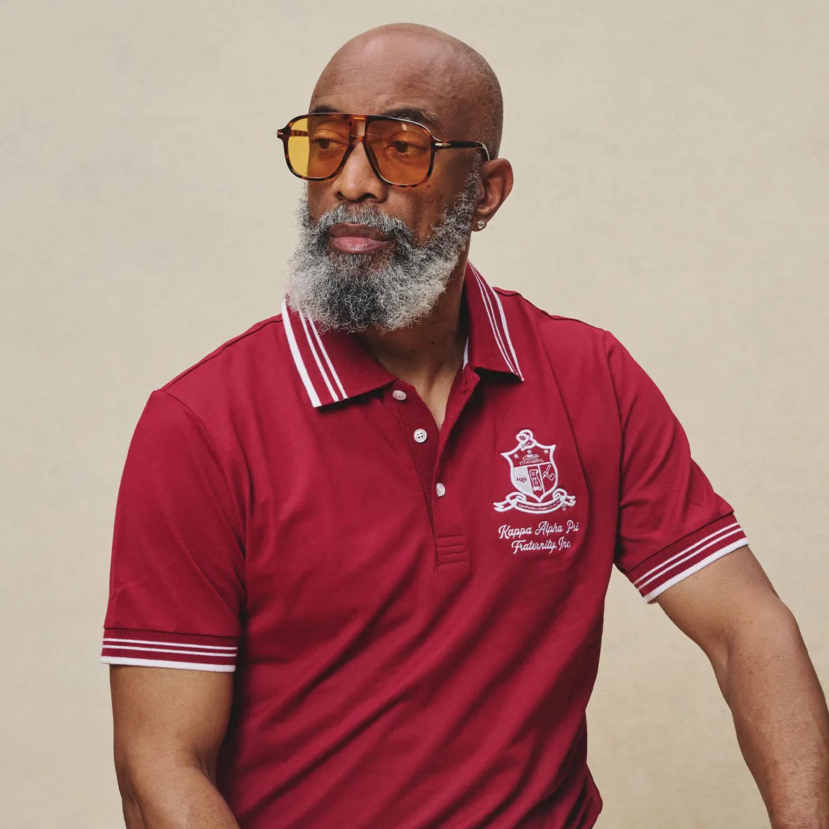 Kappa Alpha Psi Coat of Arms Striped Performance Polo